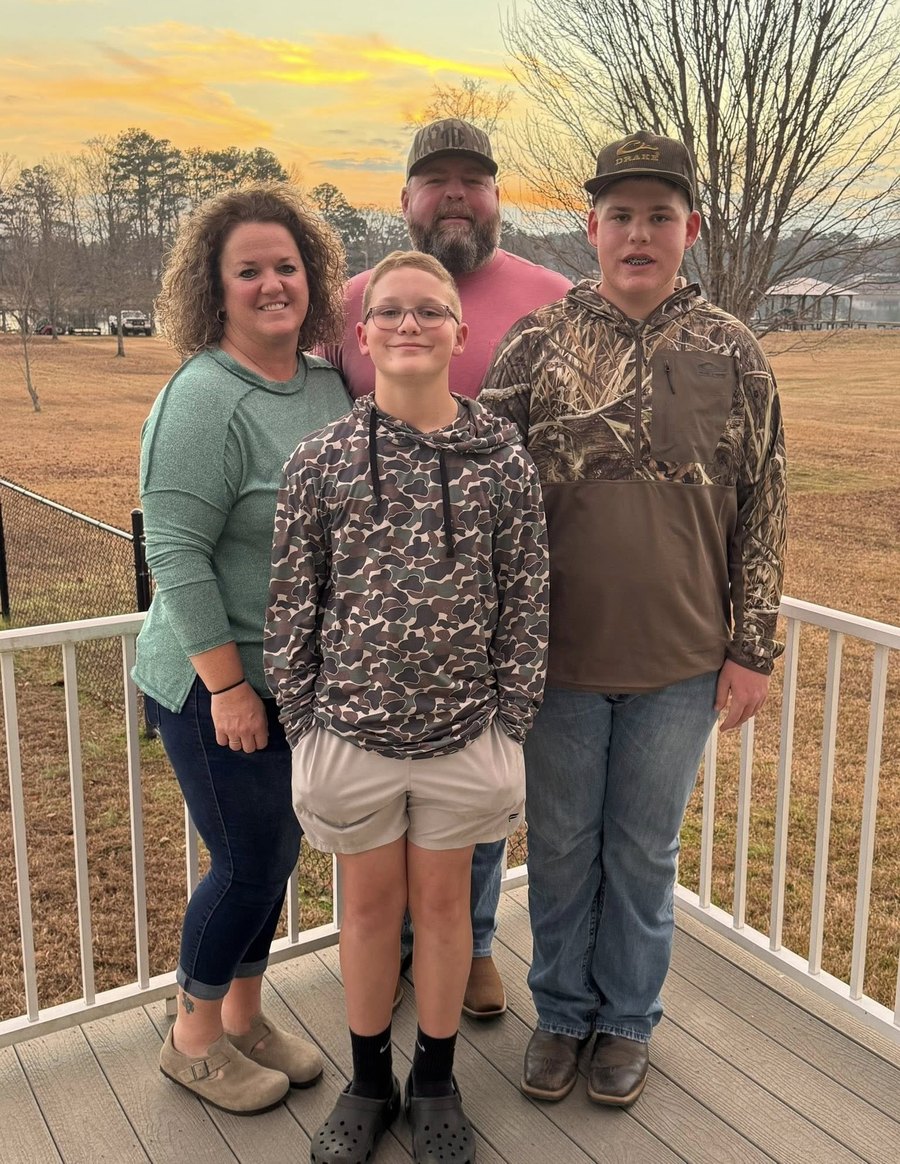 The Davis family on the deck at sunset