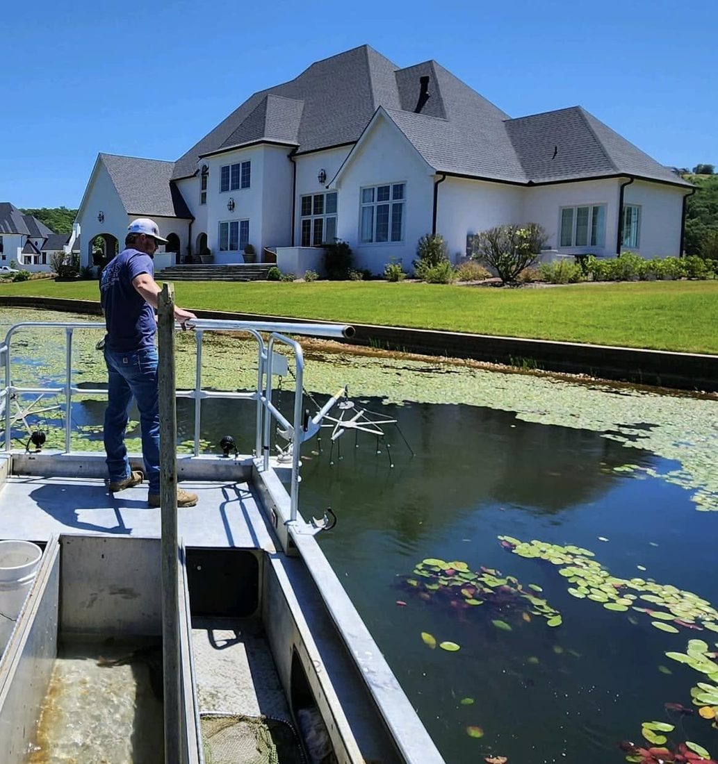 Davis Fish Farms surveying a private residential lake from the boat